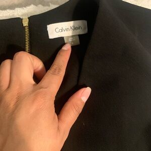 Calvin Klein Black Garment with Gold Zipper